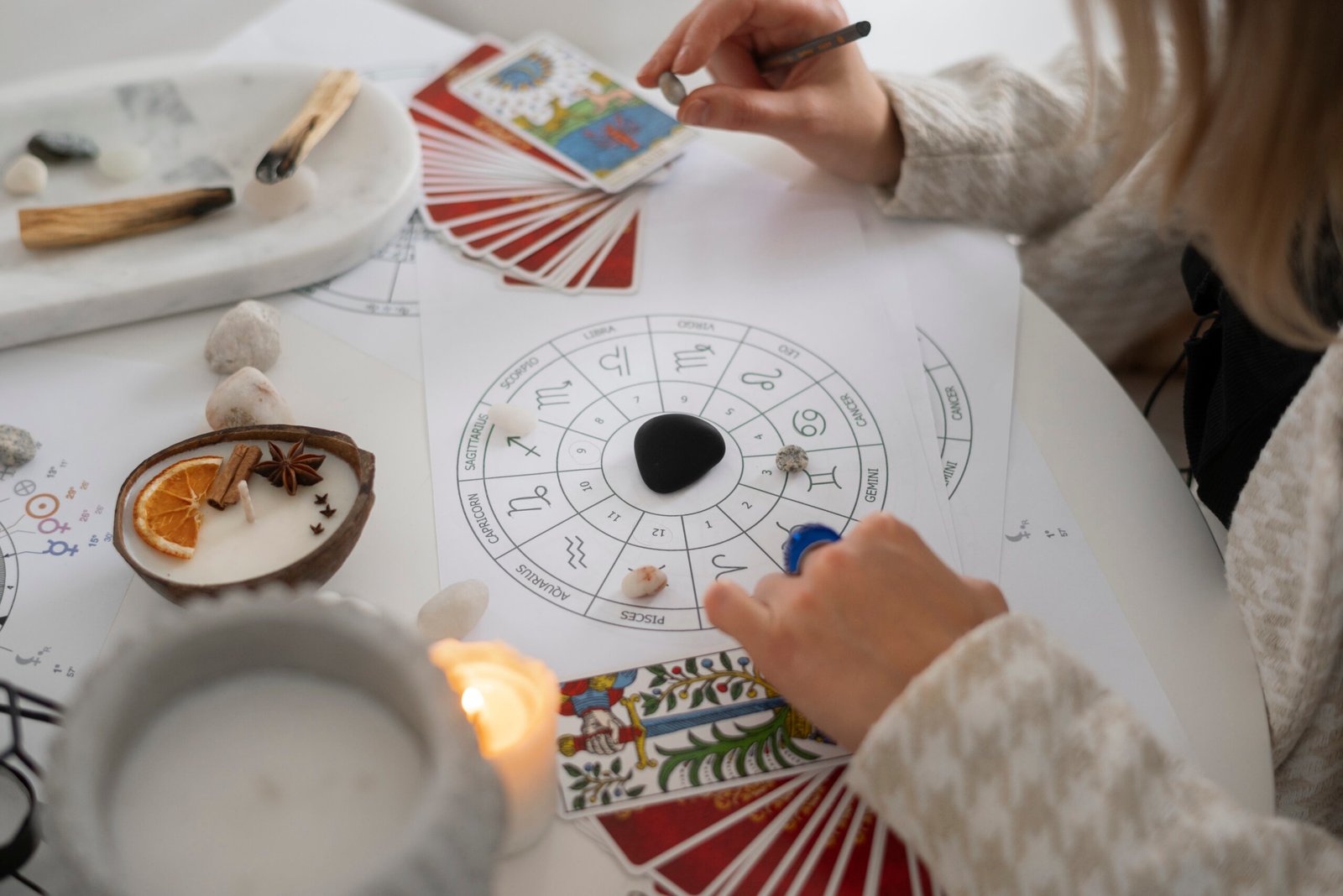 high-angle-woman-reading-tarot-home